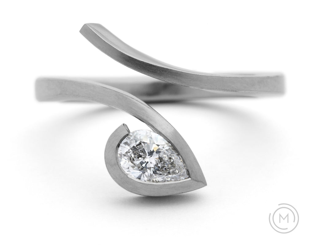 Contemporary platinum and white pear diamond engagement ring