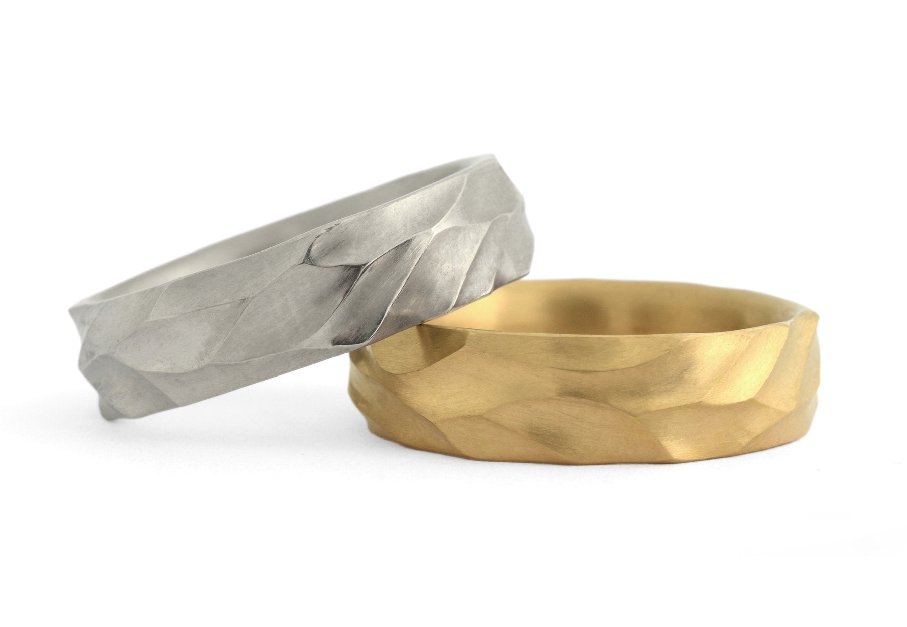 Hand-carved Dune men's wedding bands in yellow gold and platinum