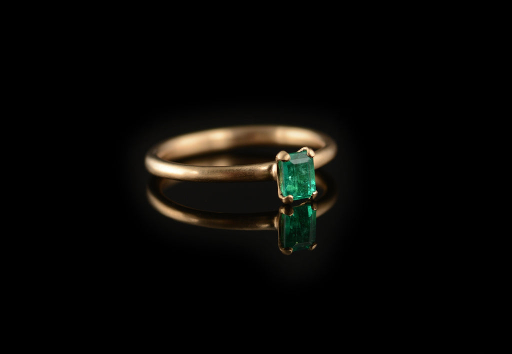 Emerald 4 claw rose gold engagement ring