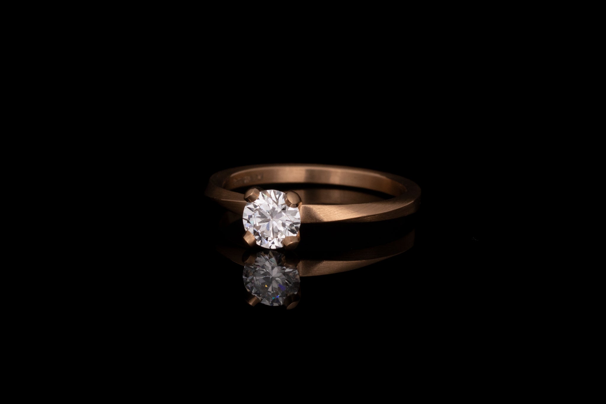 Sculpted four claw and mobius engagement ring, rose gold and white diamond