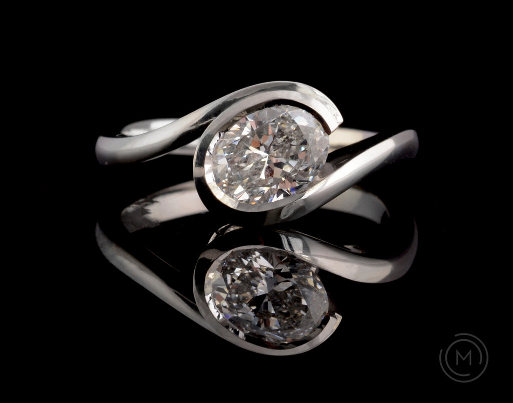 'Wave' modern platinum engagement ring with oval white diamond