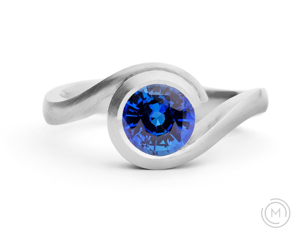 Modern platinum and blue sapphire engagement ring