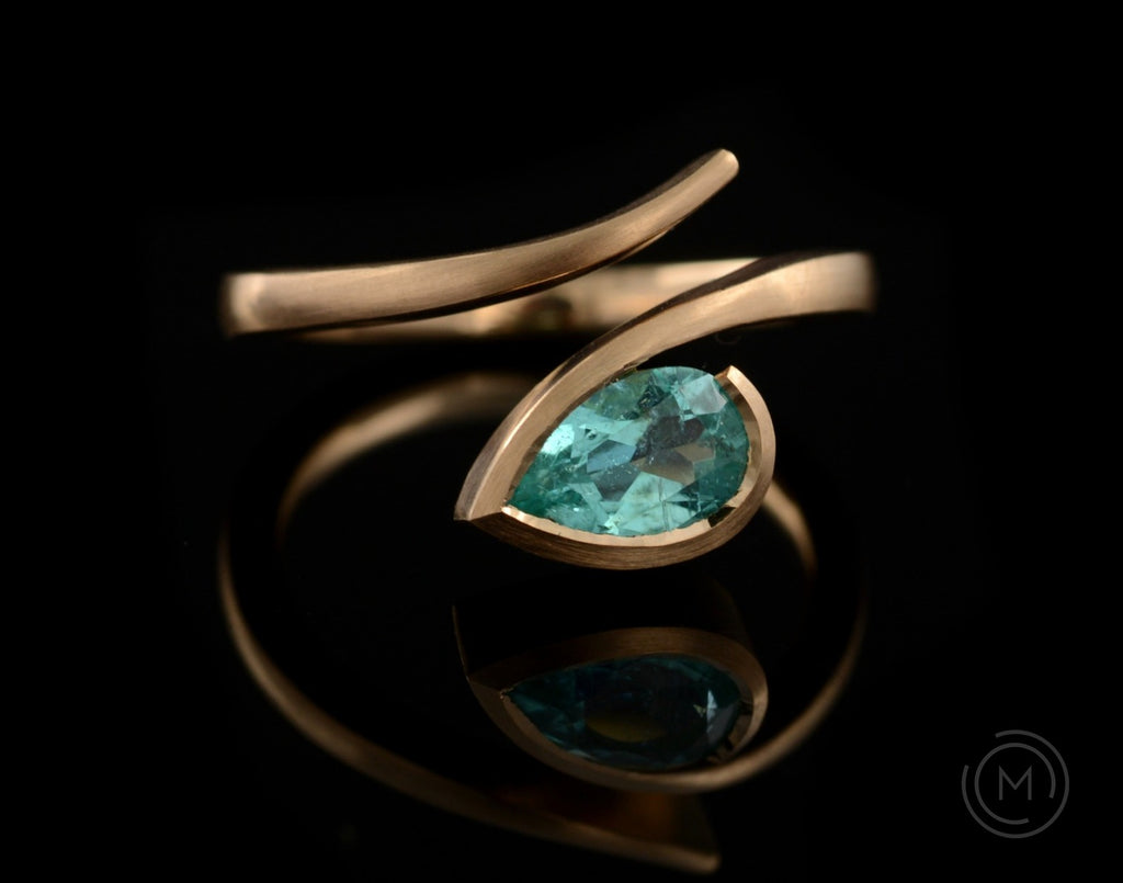 Hand-forged rose gold and pear paraiba tourmaline engagement ring