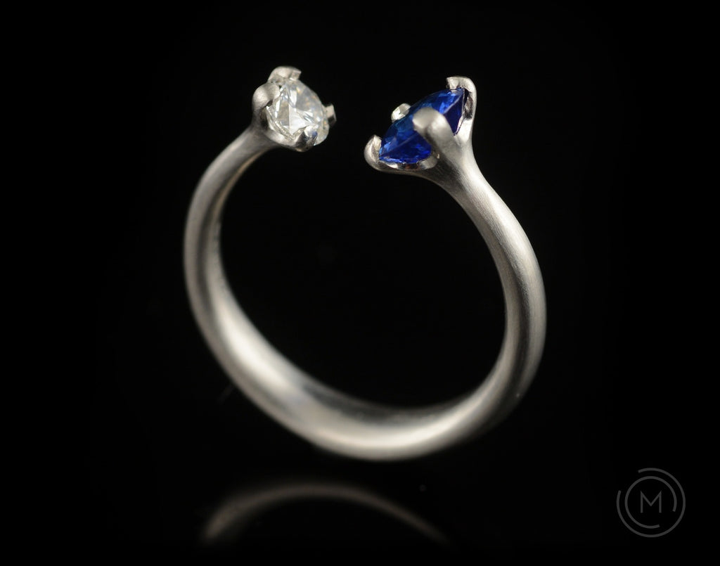 Unusual engagement ring with two stones diamond and sapphire