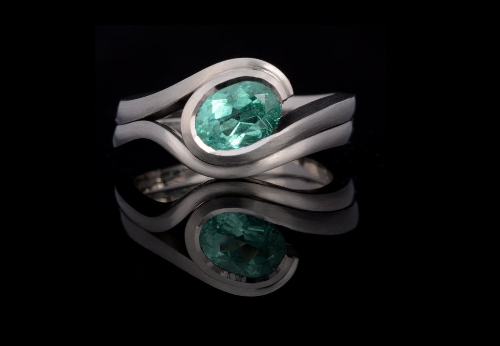 Paraiba tourmaline wave engagement ring and fitted wedding ring