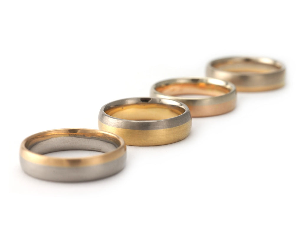 Bi-metal men's wedding rings combining contrasting colours of gold or platinum