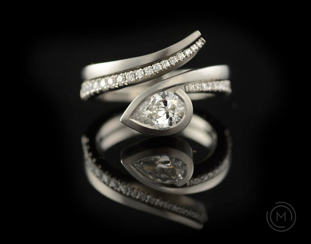 Fitted platinum engagement and wedding rings with white diamonds