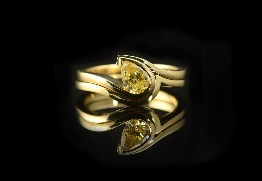 Fitted band for pear shaped yellow diamond wave engagement ring.