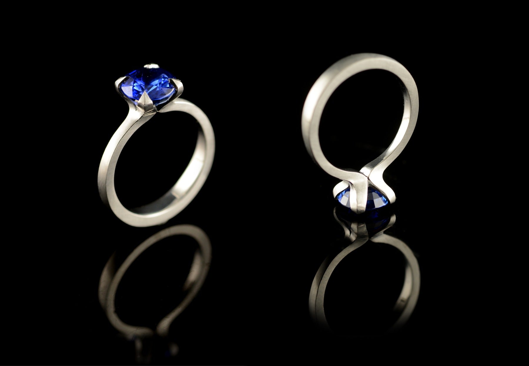 Platinum and blue sapphire ring with 4 pointed claws