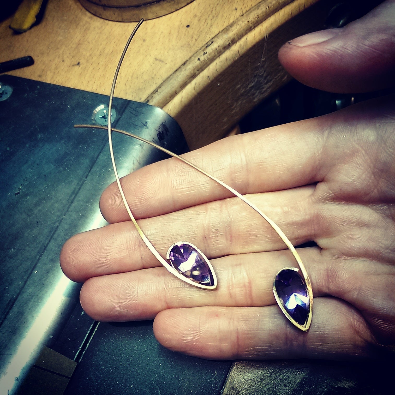 Amethyst and rose gold earrings being made