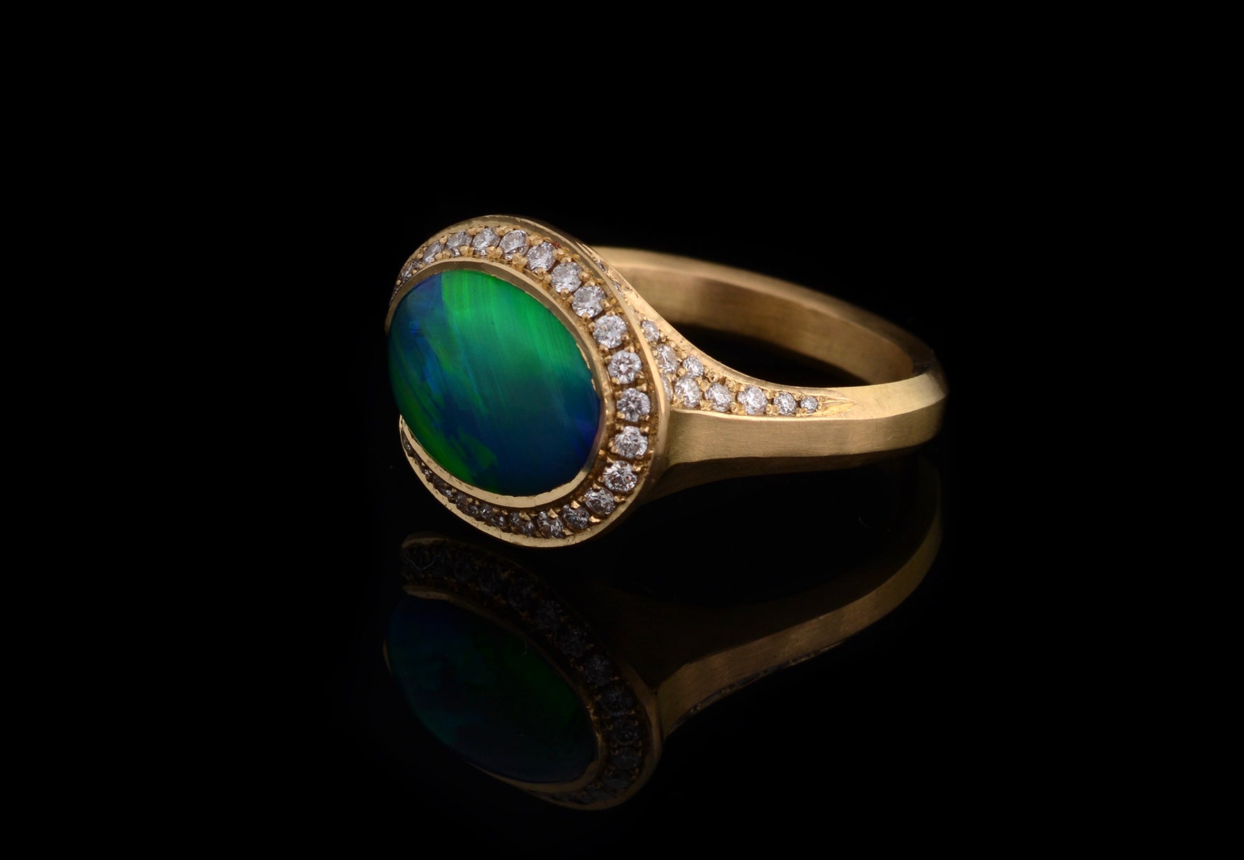 Bespoke yellow gold and opal Arris ring with white diamond halo