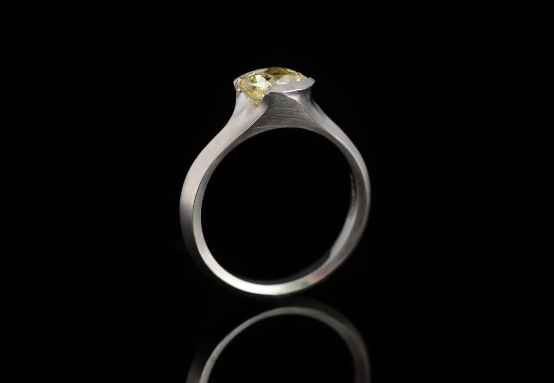 Arris platinum engagement ring with cushion cut yellow diamond 