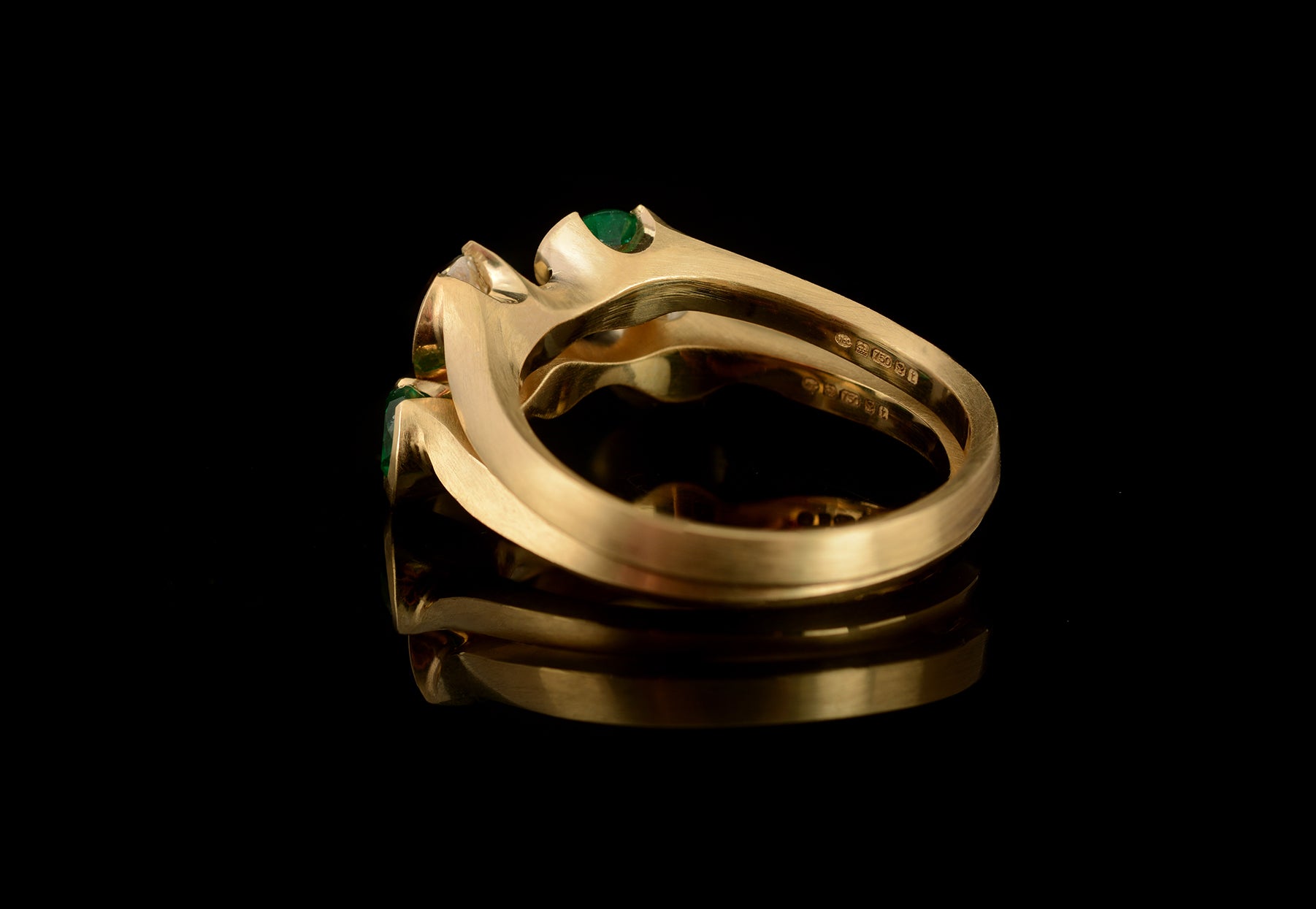 Arris bespoke fitted carved yellow gold rings set with emeralds and diamonds