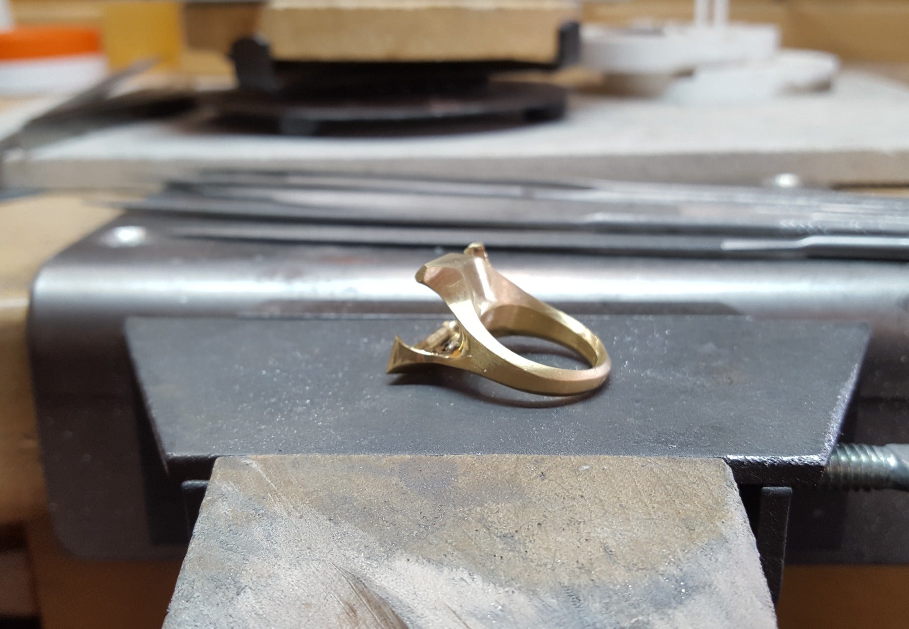 Carved 18ct gold cocktail ring with fancy-cut green tourmaline on workbench 1