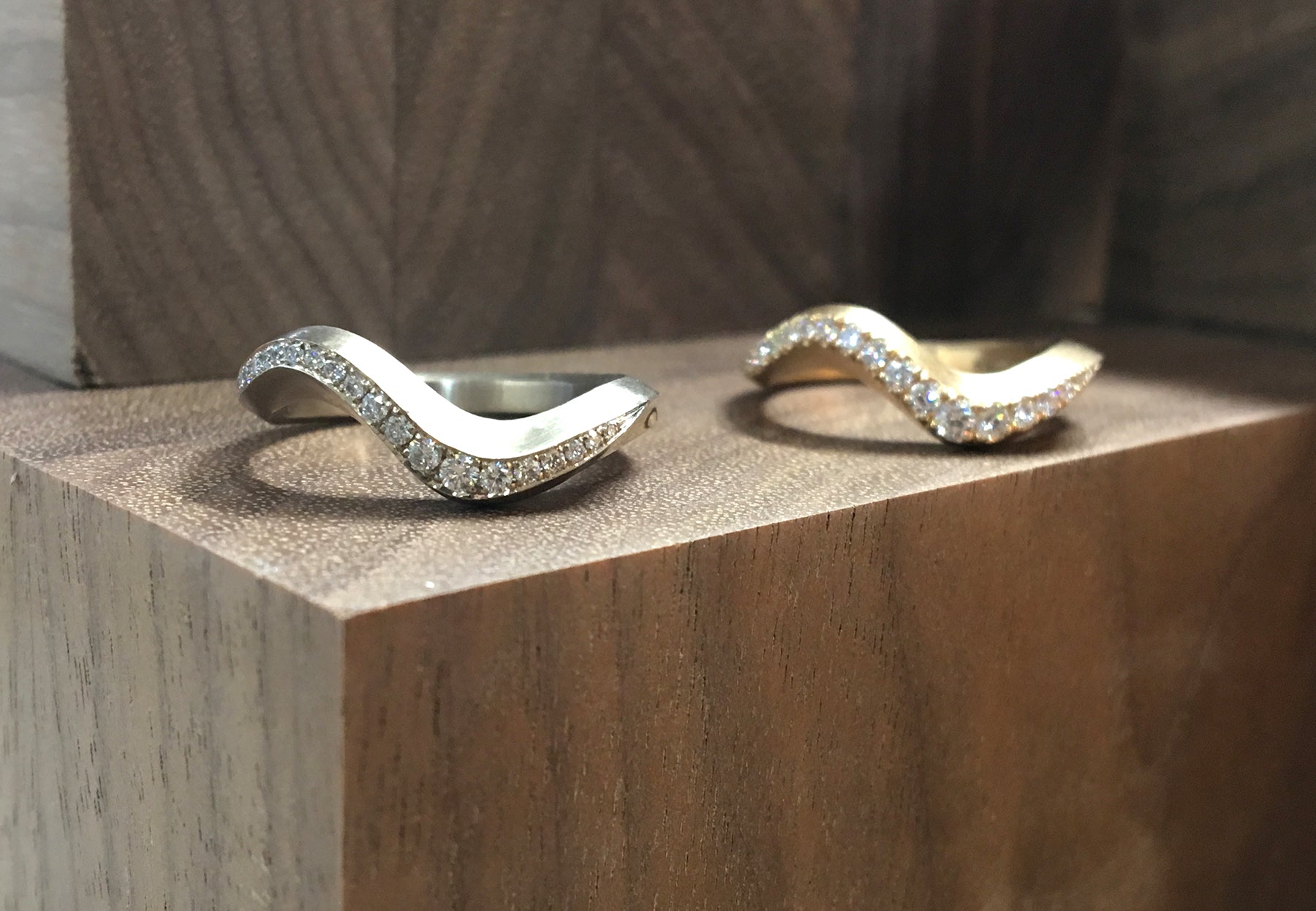 Gold Arris rings with castelle and pave diamonds