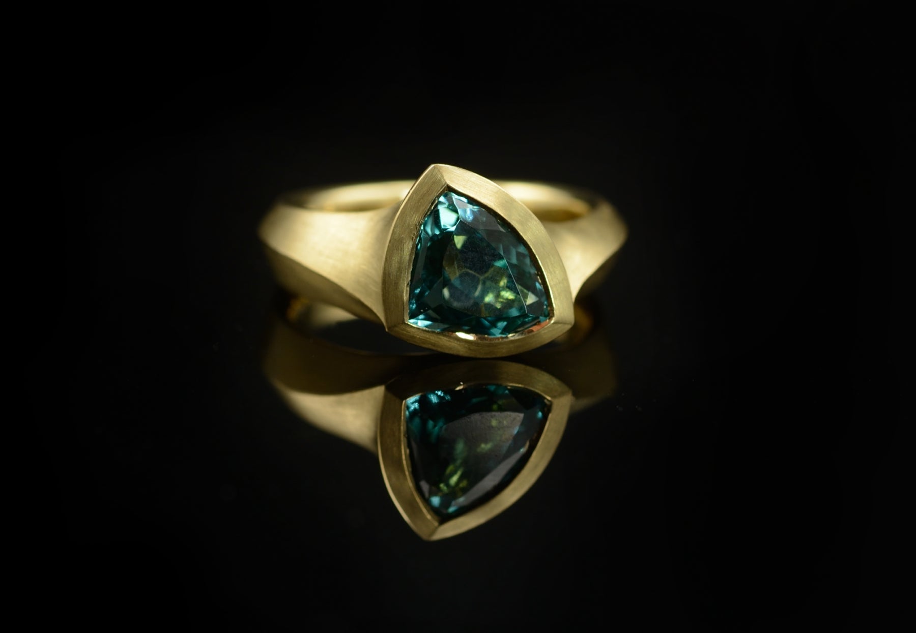 Hand carved yellow gold and trillion tourmaline engagement ring
