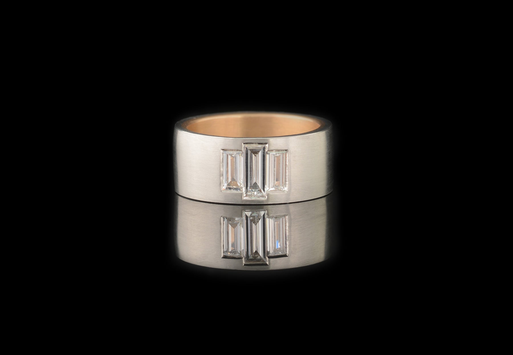 Platinum and rose gold men's ring with baguette diamonds and sapphire