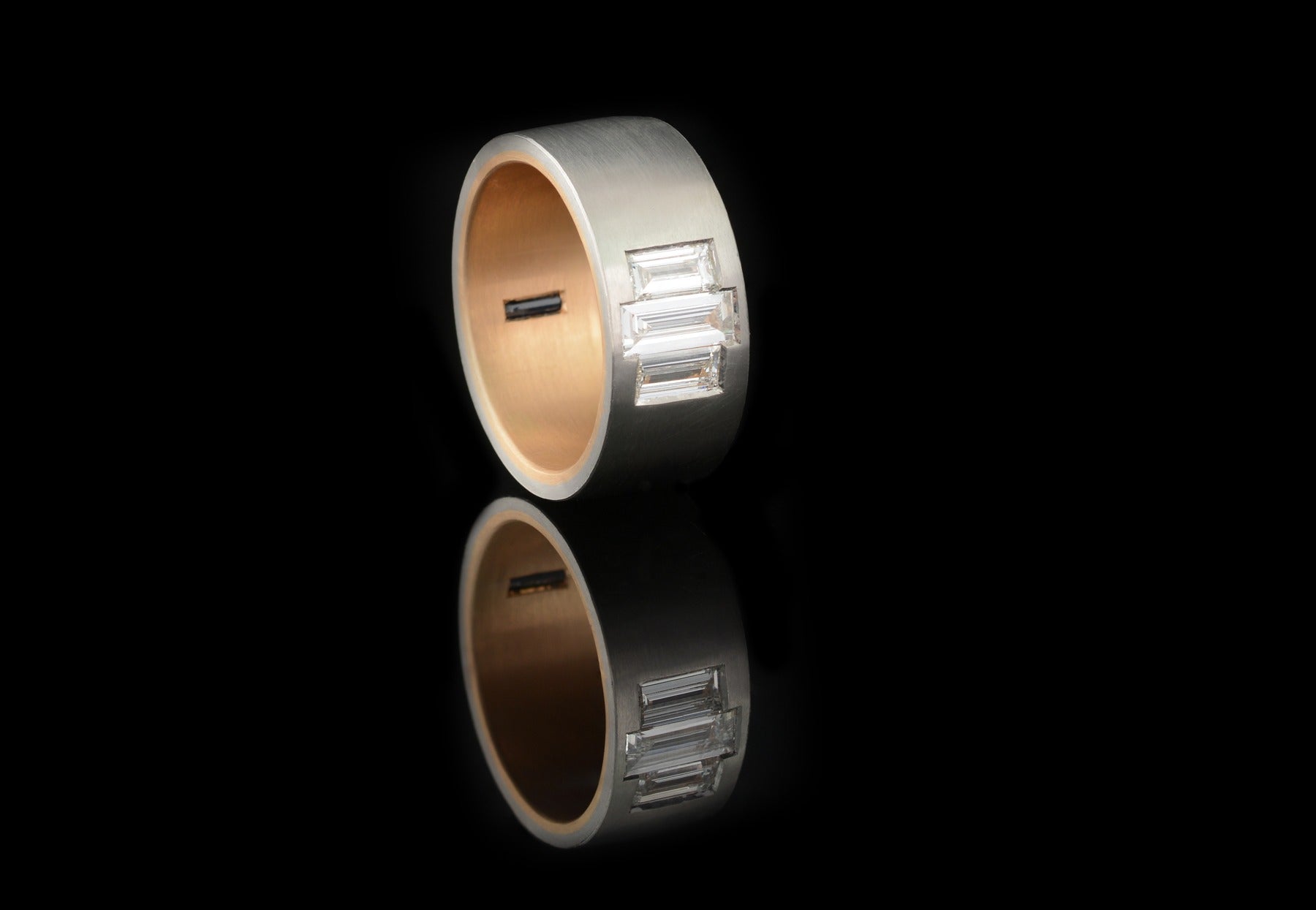 Men's platinum and rose gold ring with baguette diamonds and sapphire