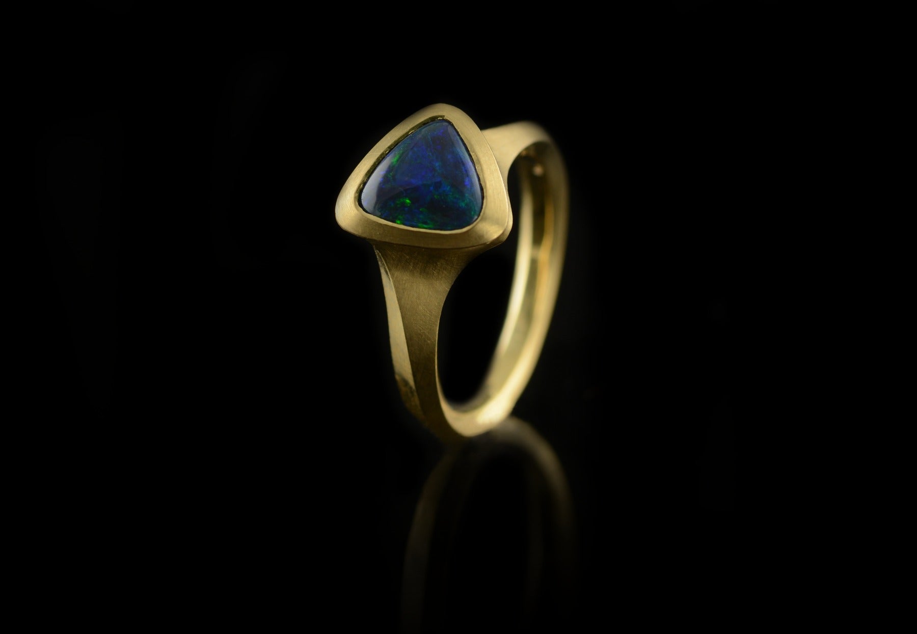 Carved yellow gold Arris ring with black opal