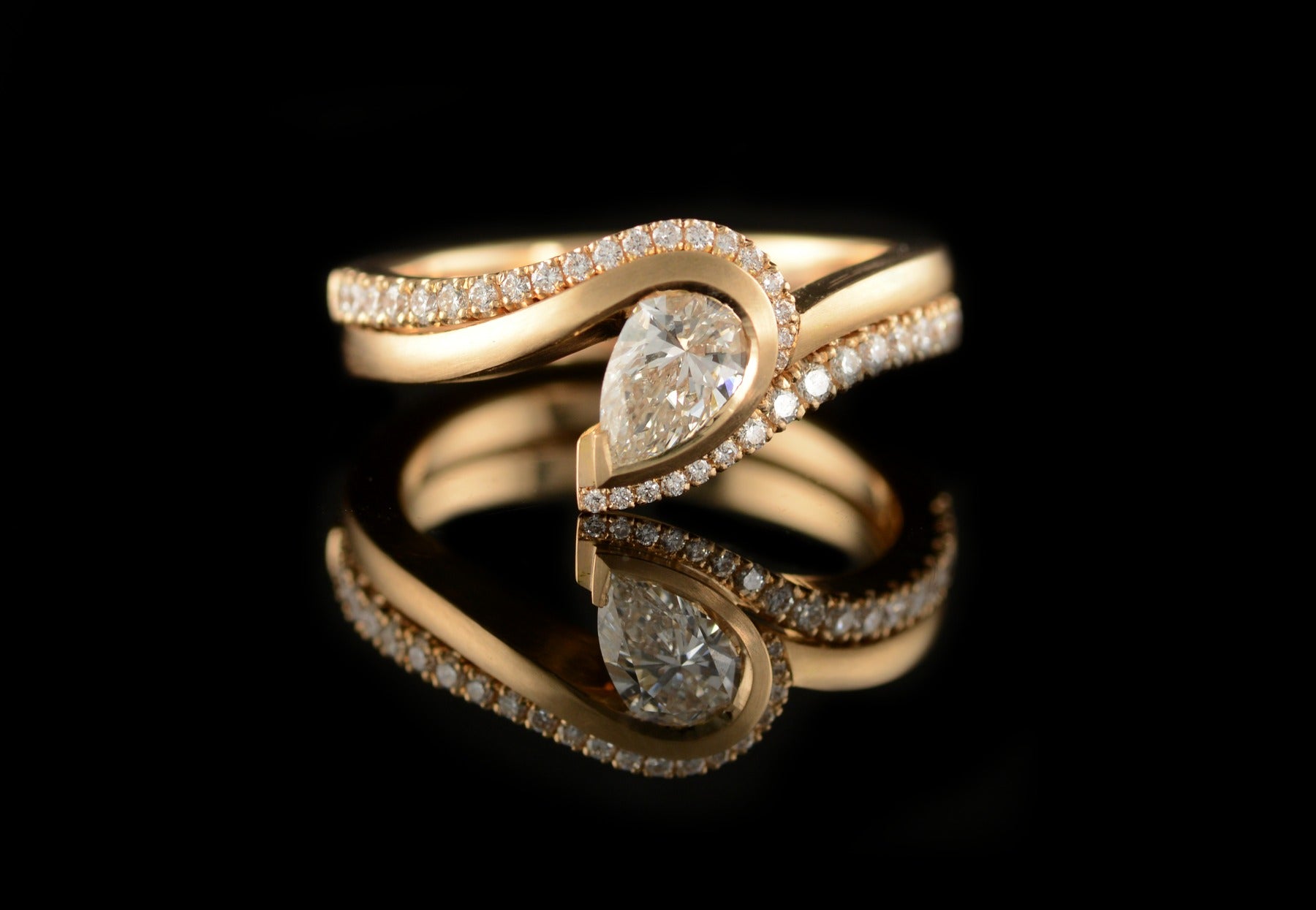 Wave pear diamond engagement and wedding ring set