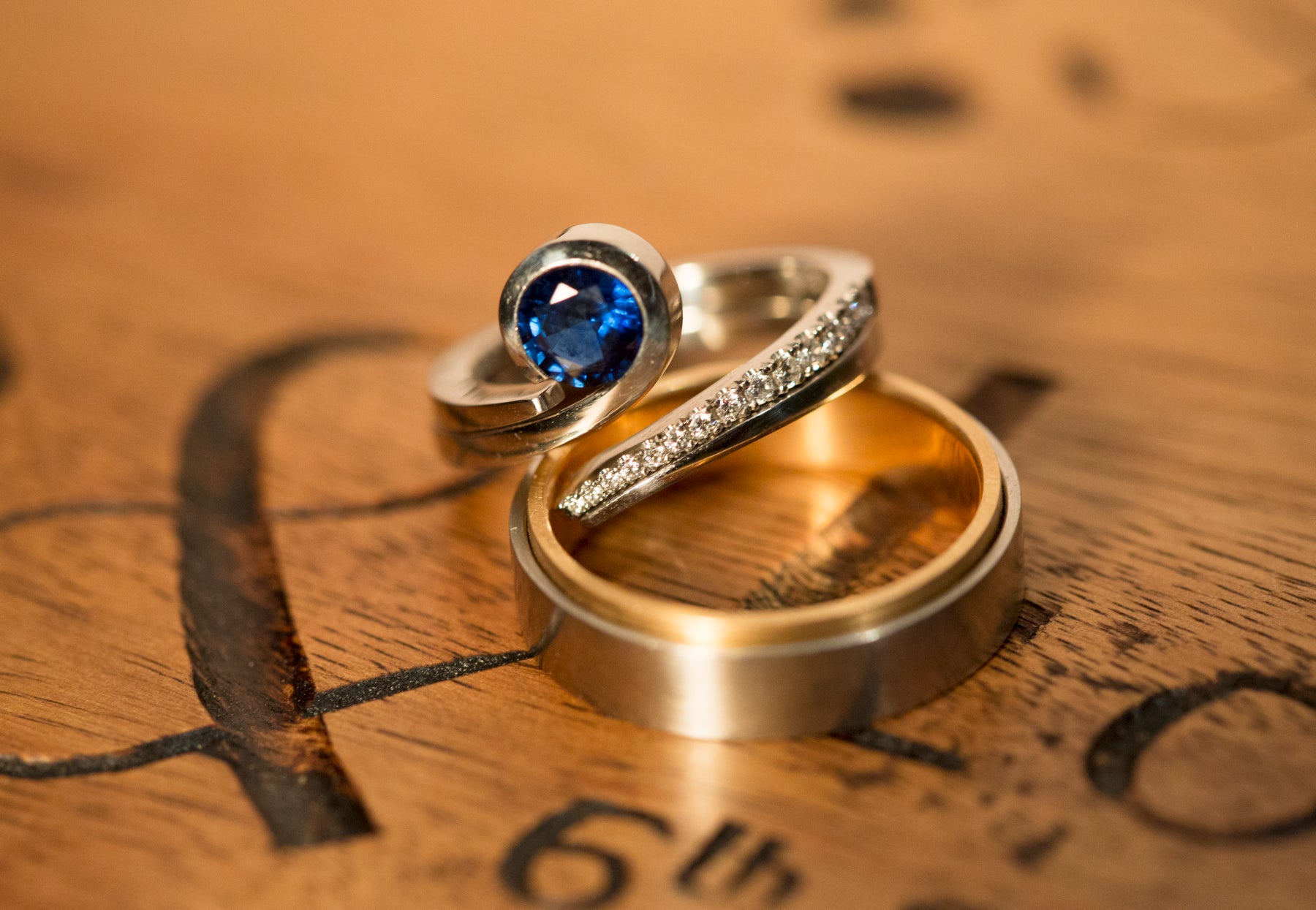 Sapphire, platinum and diamond engagement ring and wedding rings