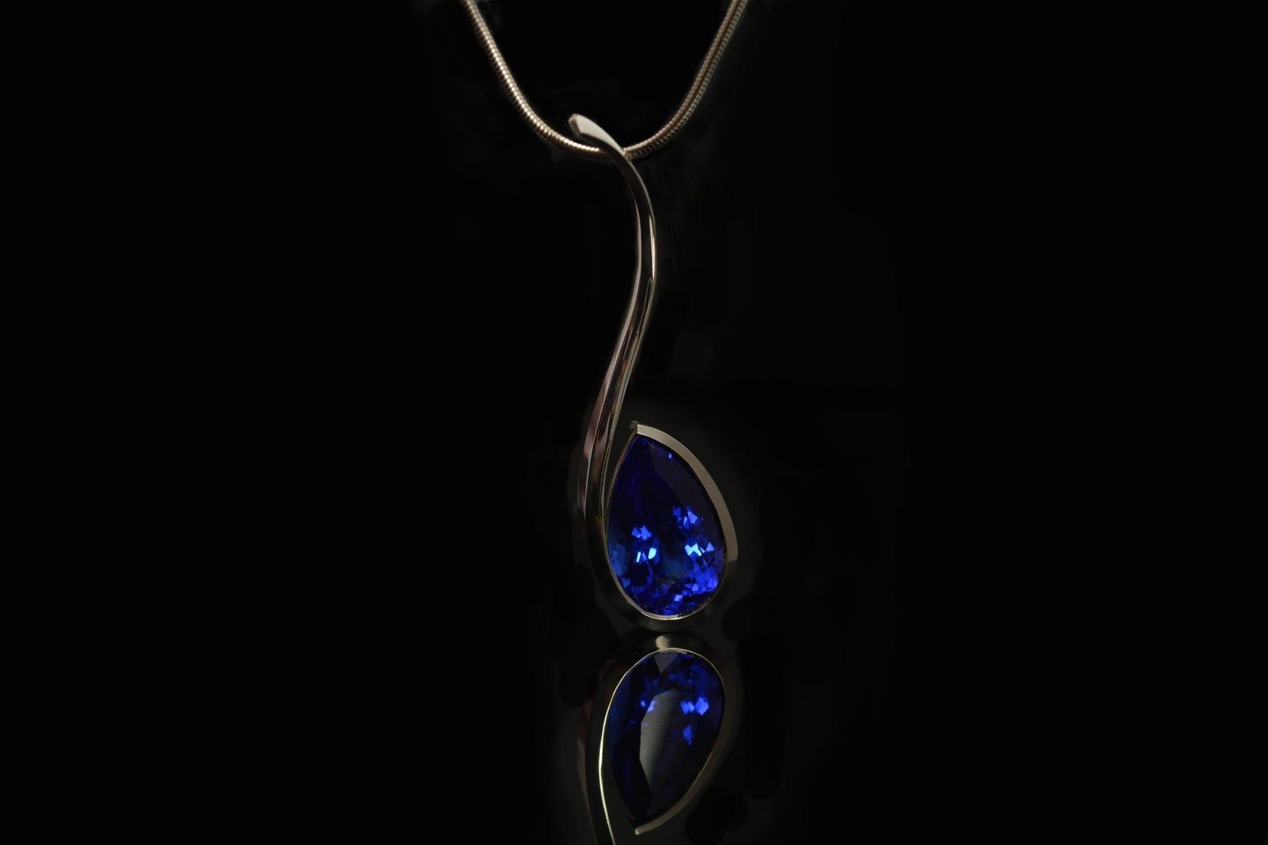 12 carat tanzanite and forged white gold pendant