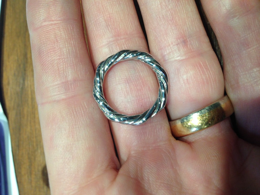 Twisted platinum wedding ring being made