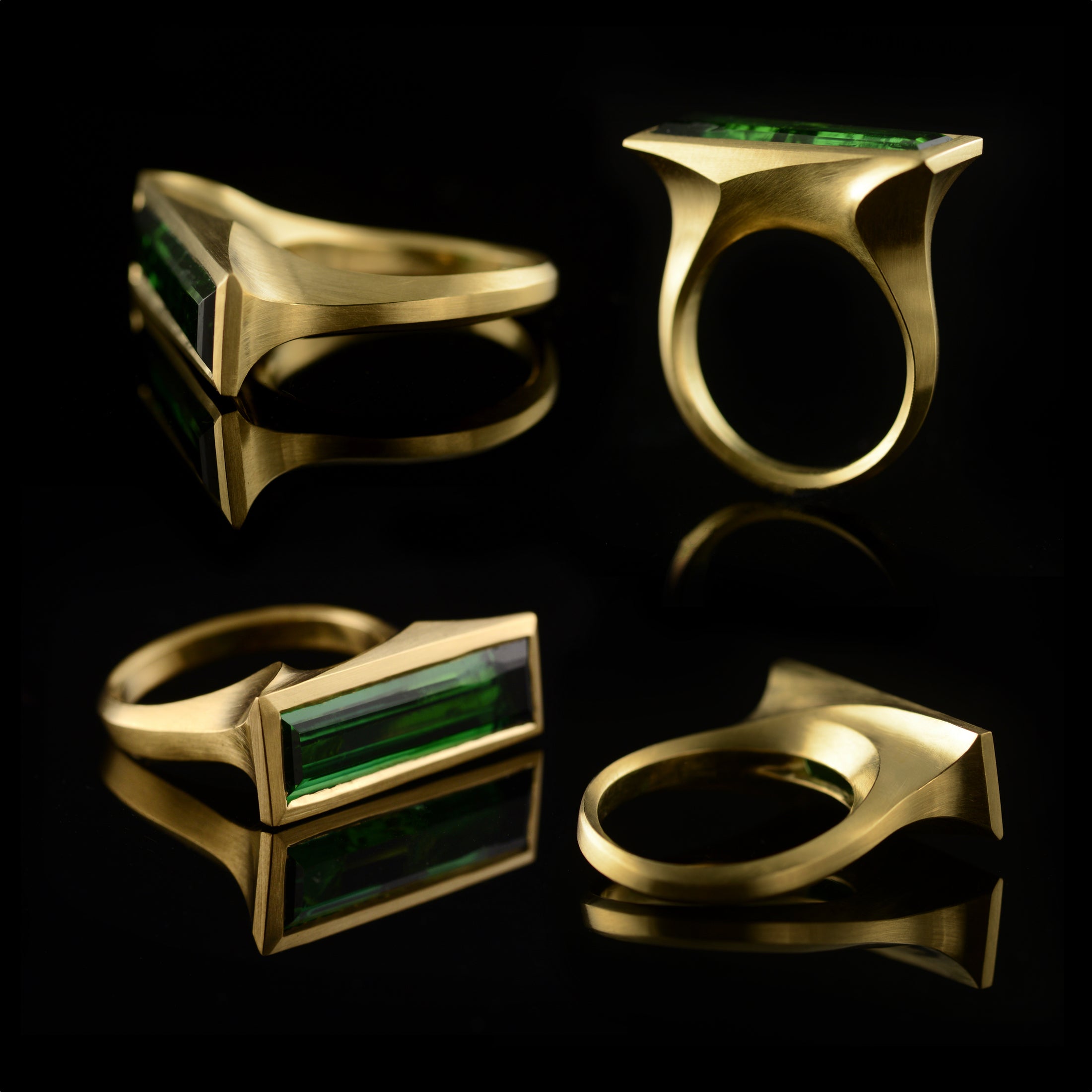 Arris carved gold cocktail ring with baguette green tourmaline 4 views