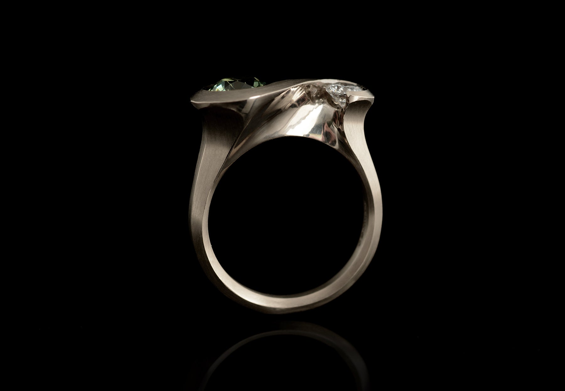 Arris carved white gold two-stone cocktail ring with green sapphire white diamond