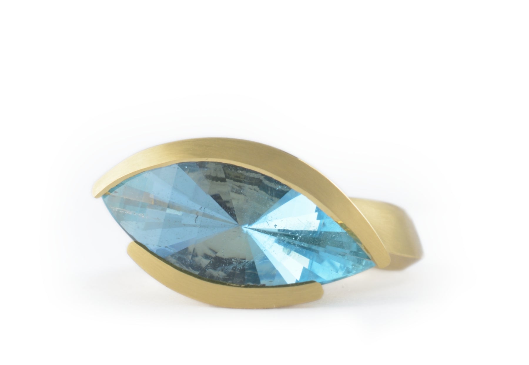 Blue aquamarine and yellow gold rings