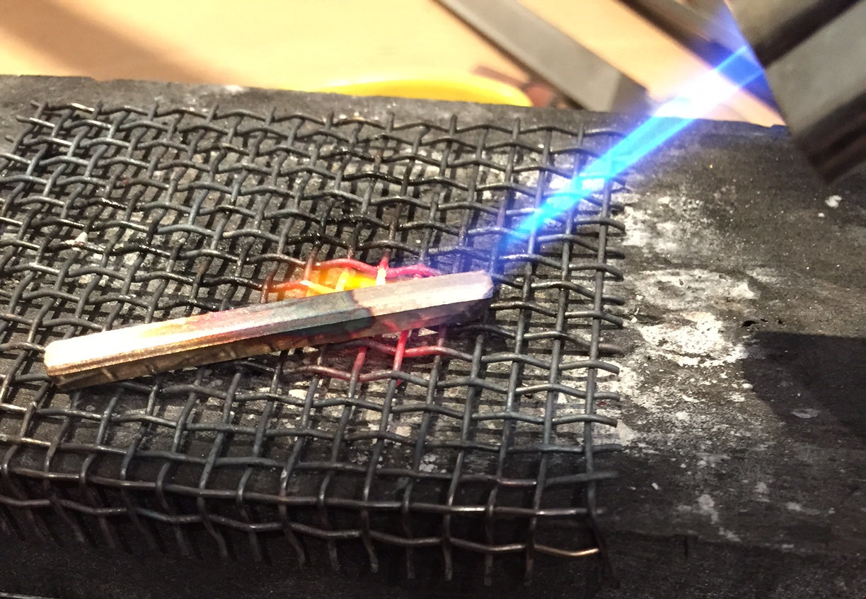 Heating a gold bar ready to forge