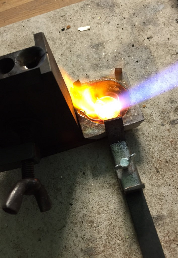 Molten gold being heated in a crucible