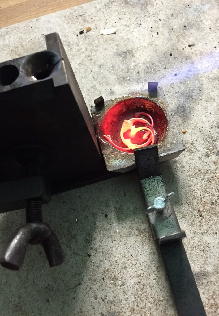 Molten gold ready to pour into an ingot mould