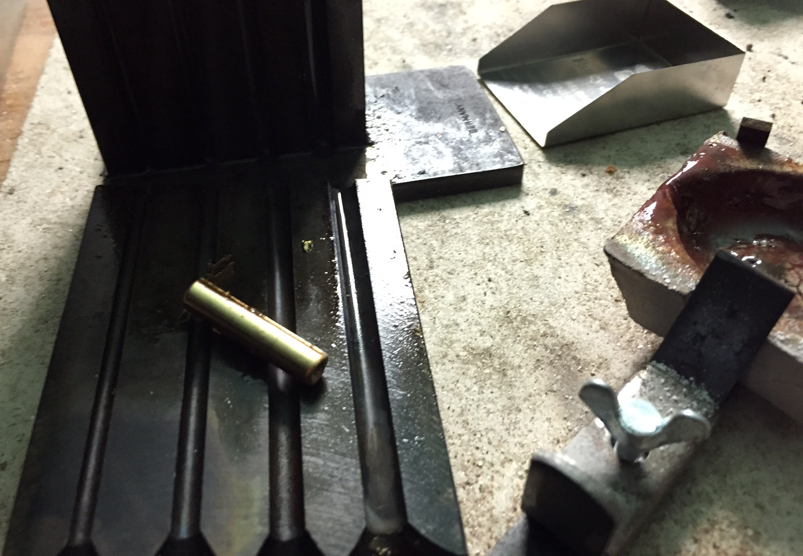 Gold being removed from the ingot mould