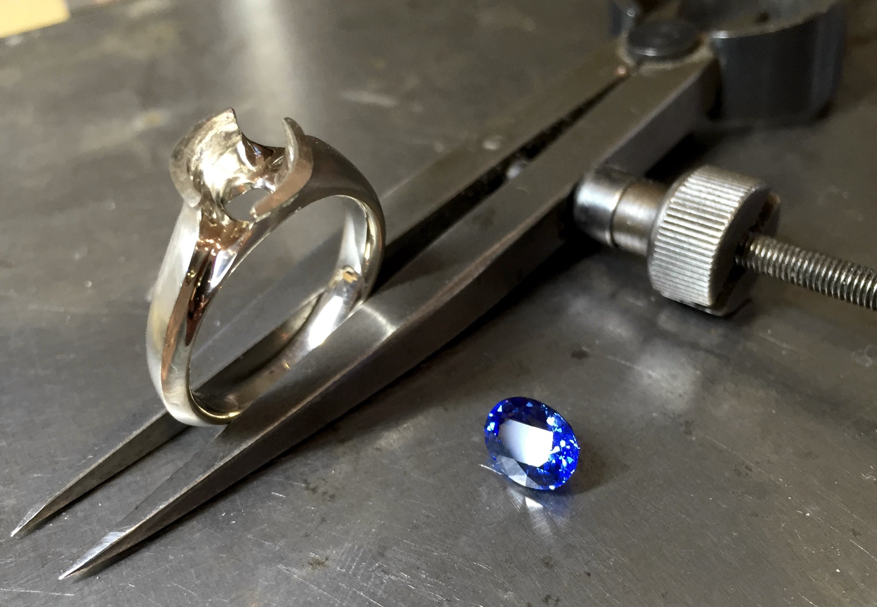 Hand carved sapphire and white gold engagement ring in progress