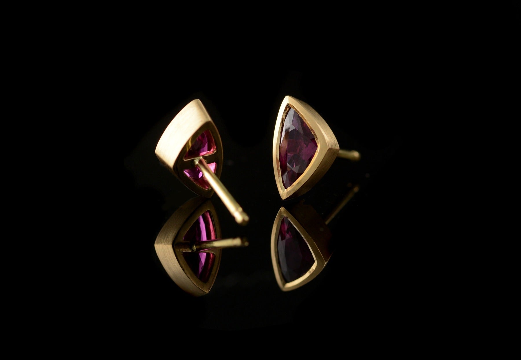 Yellow gold and trillion ruby stud earrings