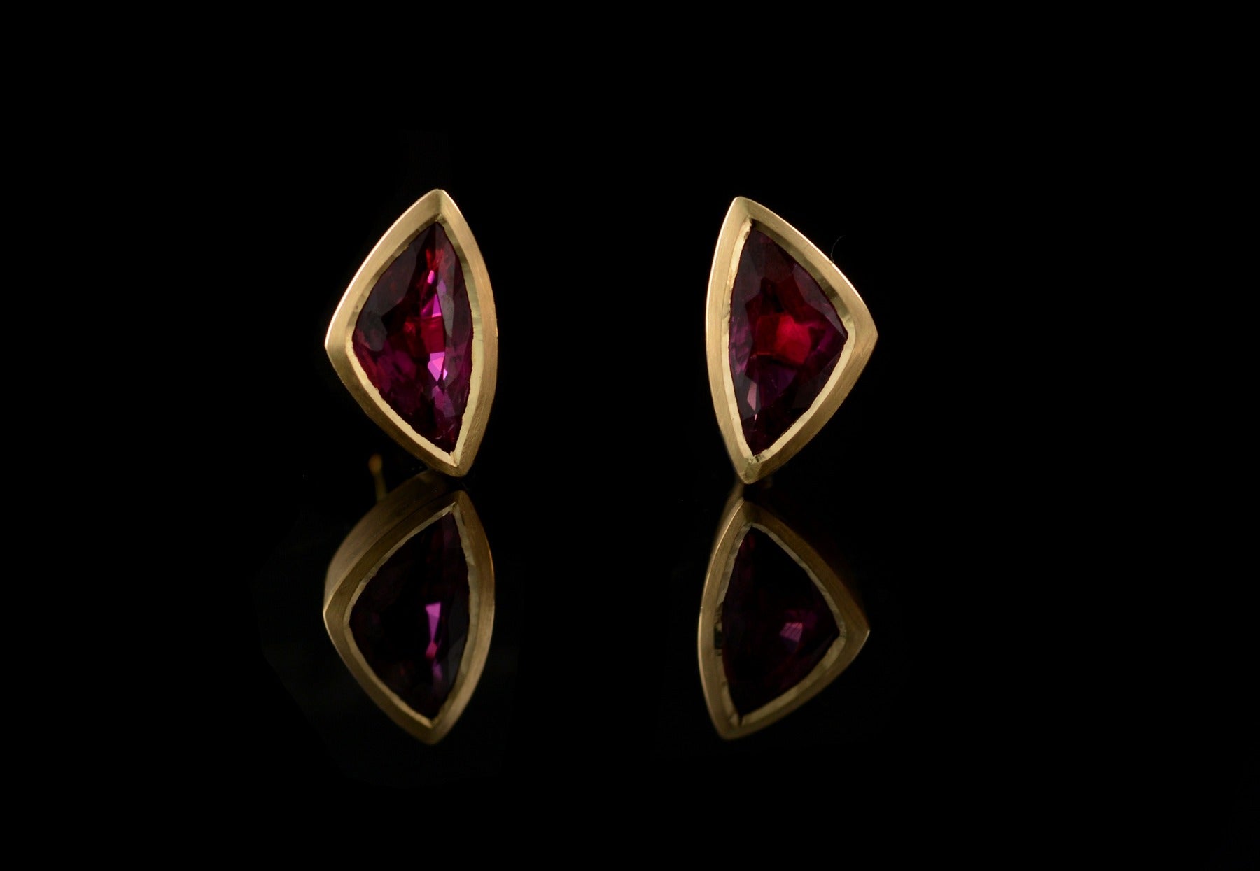 Yellow gold and trillion ruby stud earrings