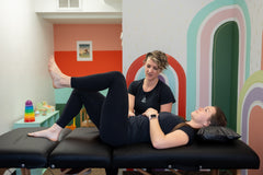 Therapist teaching pelvic floor exercises for overactive bladder