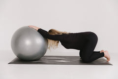 Exercise ball round ligament stretch