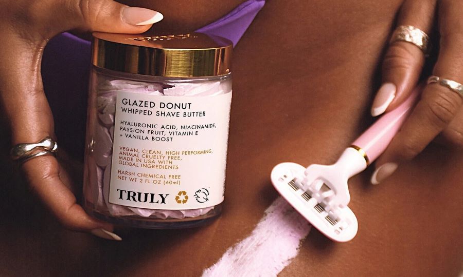 is waxing better than shaving | closeup of glazed donut whipped shave butter with swipe on skin and razor