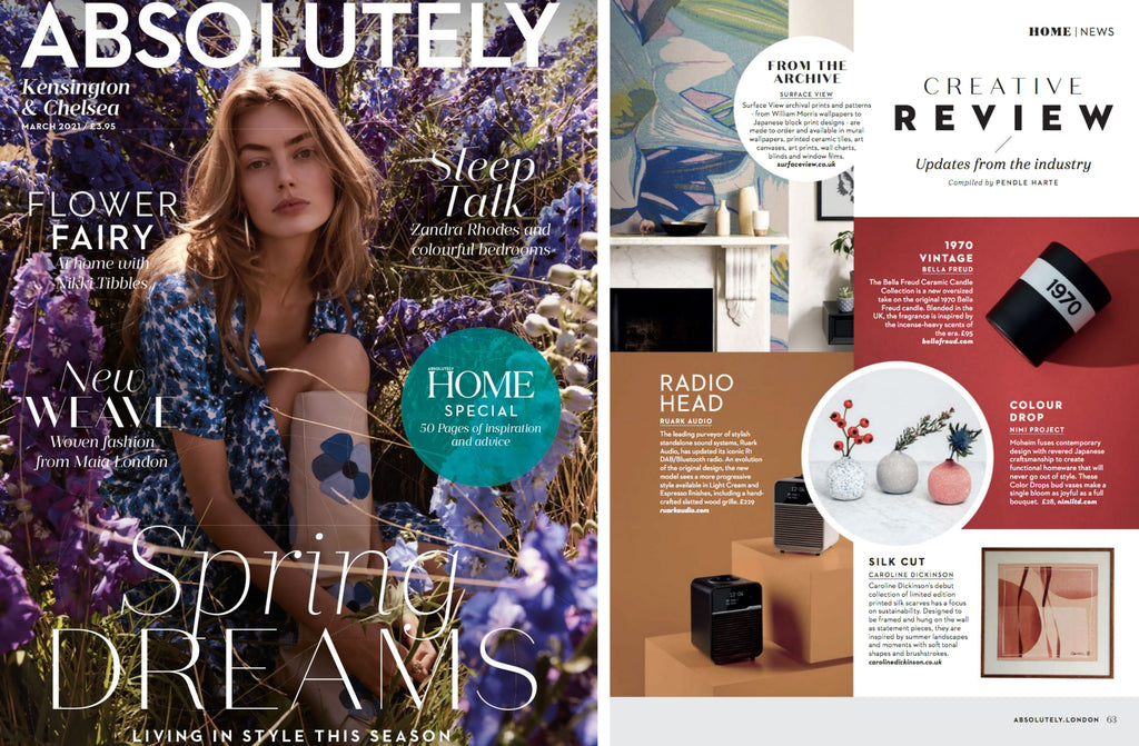 NiMi Projects Moheim Color Drops Vase, three bud vases — white speckled with blue, grey speckled with white, and red speckled with white —  featured in the center of a spread of Absolutely London Magazine