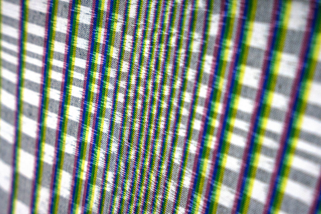 Textile designer Hana Mitsui's Blurring Checker fabric, made with traditional Japanese kasuri weaving techniques, with dyed threads that have been purposely misaligned to create a hazy checked pattern.