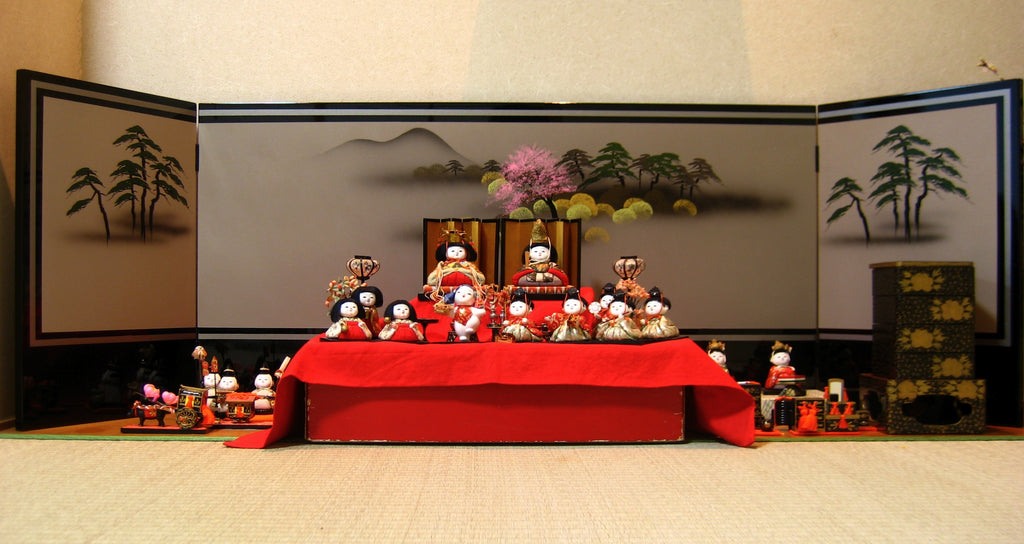 A Japanese Hinamatsuri, Doll's Festival, set of dolls, depicting a Heian court, including the Emperor and Empress, court ladies, guards and musicians.