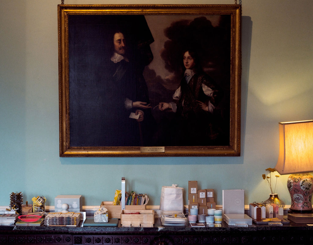 NiMi Projects contemporary Japanese homeware on display on an antique table below a 19th-century painting at Chiddingstone Castle, Kent.