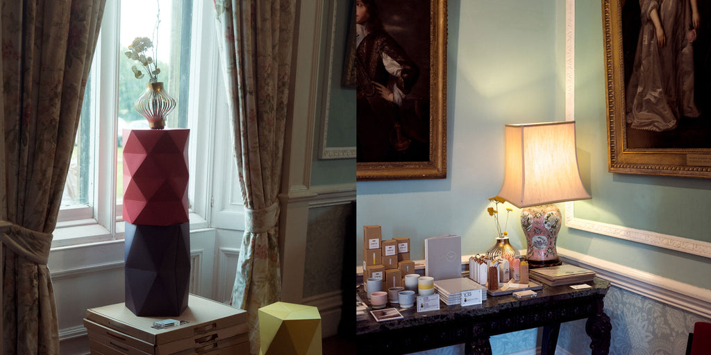 Composite of two images. Left: A Fukunaga paper vase with flowers on top of a red Catachi Polystool stacked on top of a blue Catachi stool, on display in front of a window in Chiddingstone Castle. Right: NiMi Projects Japanese homeware  on display on an antique table, with 19th-century paintings above, at Chiddingstone Castle.