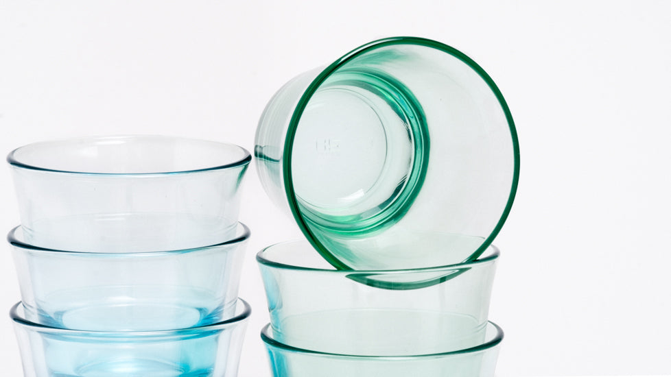 A close up image of several Japanese glass Spash Tumblers in blue and green, available at NiMi Projects UK