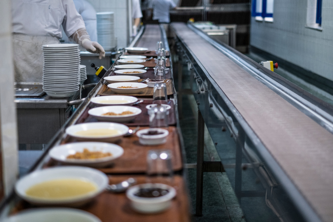 A line of hospital food being prepared to serve patients