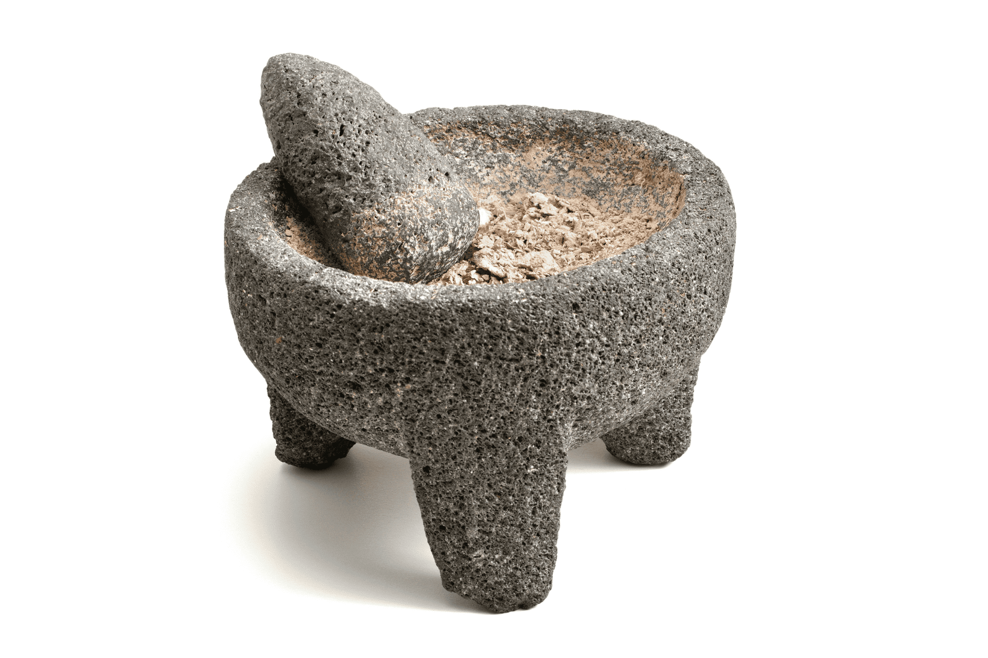 A mortar and pestle made from volcanic rock