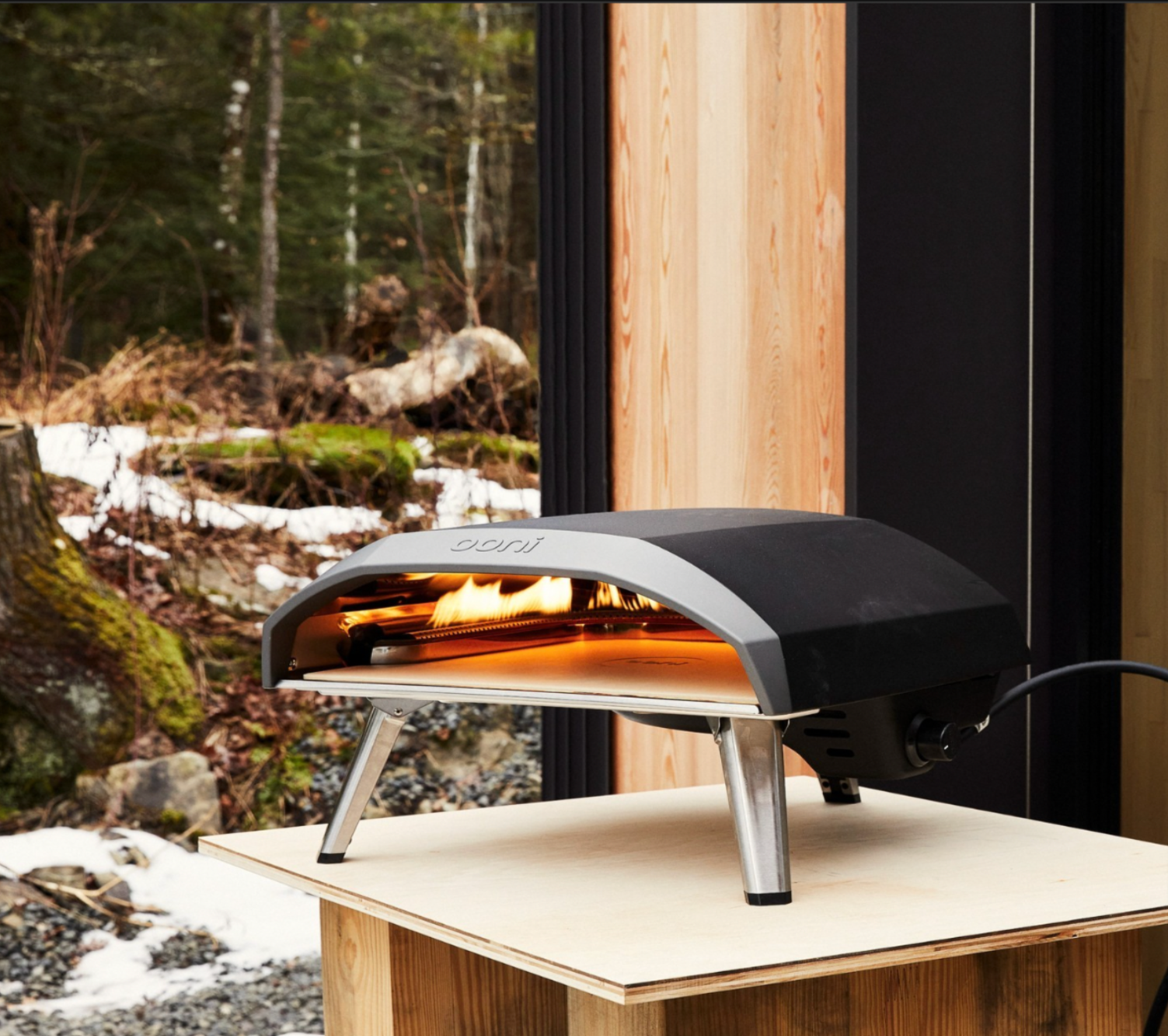 An Ooni pizza oven heating its interiors