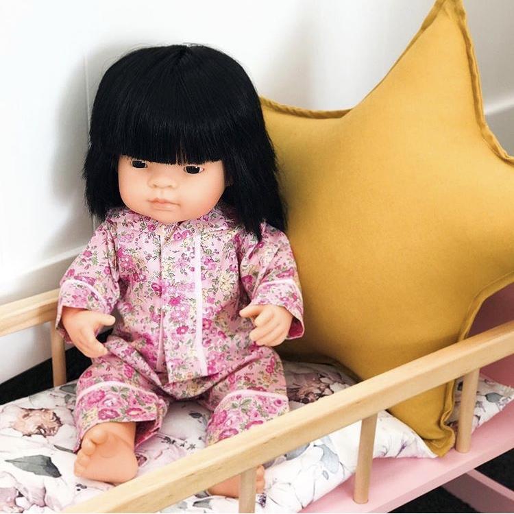 Miniland Asian 38cm doll in wooden crib with mustard yellow star cushion